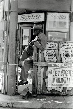 Man outside a liquor store in Oakland, California, 1962 Man outside a liquor store in Oakland, California, 1962